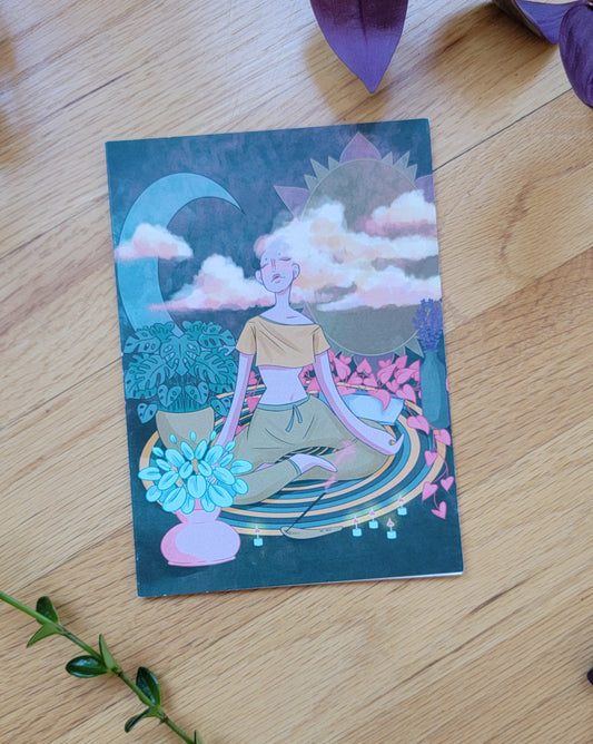 some plants frame a greeting card, laying closed so the front is visible.