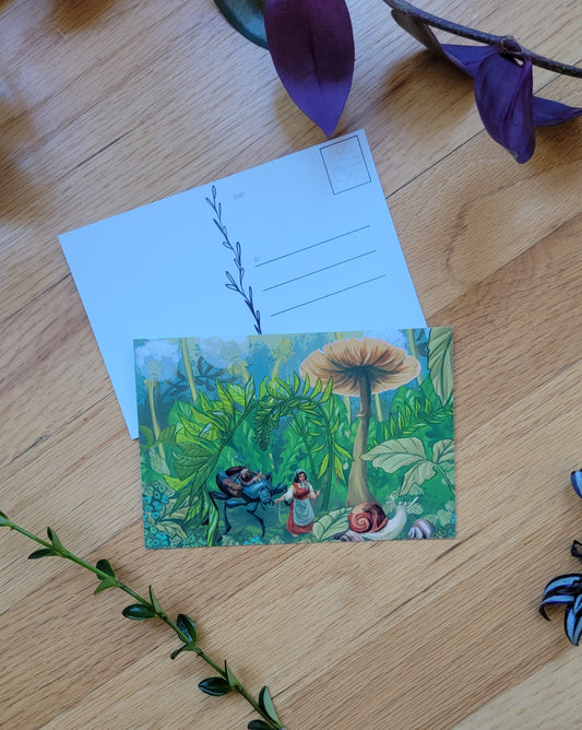 a photo of two post cards, one overlapping the other. Plants frame the image.
